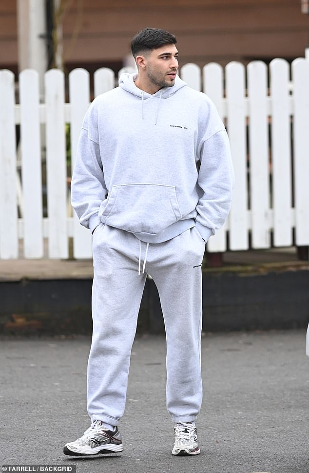 To complete his look, he sported a pair of chunky off-white trainers as his pals followed behind