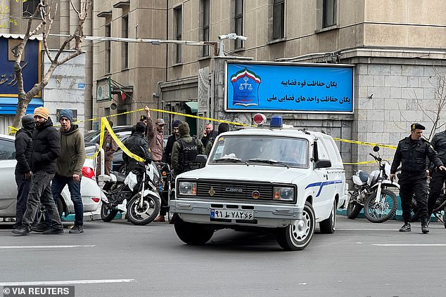 Police stand in front of the judiciary building after the assassination of the Supreme Court Judges Mohammad Moghiseh and Ali Razini in Tehran, Iran, January 18, 2025