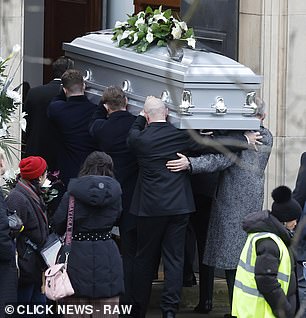 A picture of a casket being carried by the cast