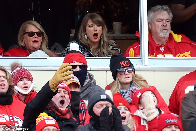 She was sat alongside mom Andrea (left) and Kelce's dad Ed (right) in the VIP suite