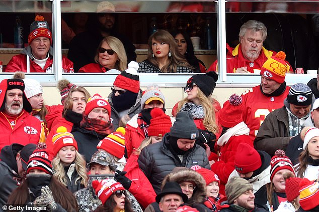 Her dad Scott (left), a self-confessed Eagles fan, was also in attendance wearing a Chiefs hat