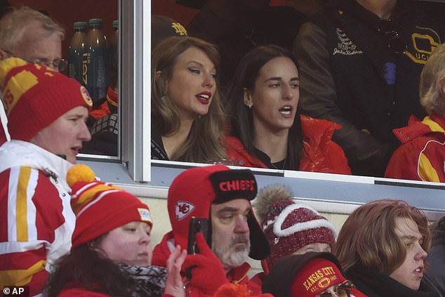 Clark and Swift were pictured sat together during the third quarter of Saturday's game