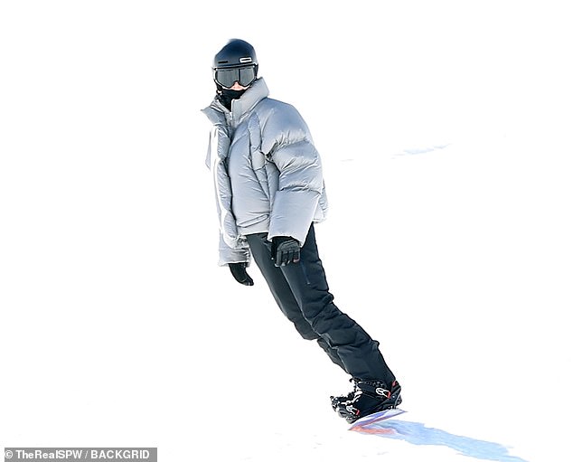 Kendall showed off her skiing skills as she rode down one of the steep slopes while sporting a silver, puffy jacket as well as black pants