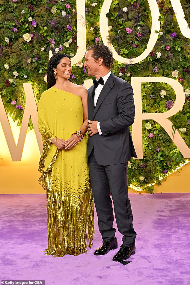 Camila Alves McConaughey and Matthew McConaughey put on a loved up display on the purple carpet