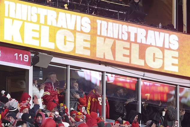 Clark and Swift pictured hugging in the VIP suite after Kelce's fourth quarter touchdown