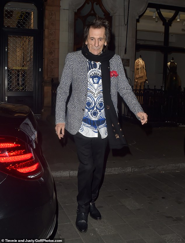 The rocker looked effortlessly stylish in a Versace shirt and polka dotted blazer