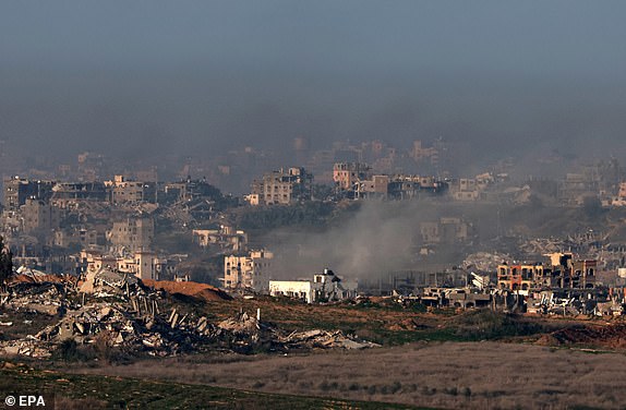 epa11835425 Smoke rises as a result of Israeli military shelling on the northern Gaza Strip, as seen from the Israeli-Gaza border near Sderot, southern Israel, 19 January 2025, before a ceasefire in Gaza is set to come into effect. Israel and Hamas agreed on a hostage release deal and a Gaza ceasefire to be implemented on 19 January 2025.  EPA/ATEF SAFADI