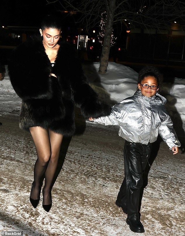 Her daughter Stormi looked cute in a silver padded jacket as she sweetly held onto her mum's hand