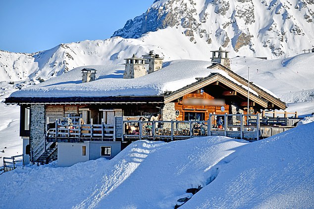 The couple and their children were spotted enjoying morning hot drinks at a mountaintop restaurant that is a popular stop-off point for British skiers and has panoramic views of snow-covered peaks