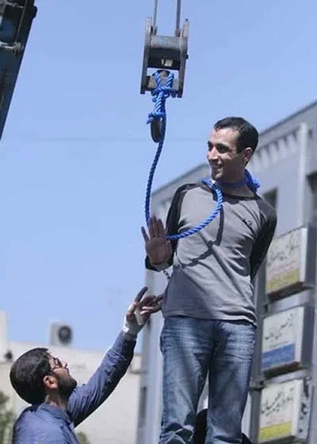 The brave Iranian can be seen in resurfaced images waving at crowds of onlookers moments before his public execution