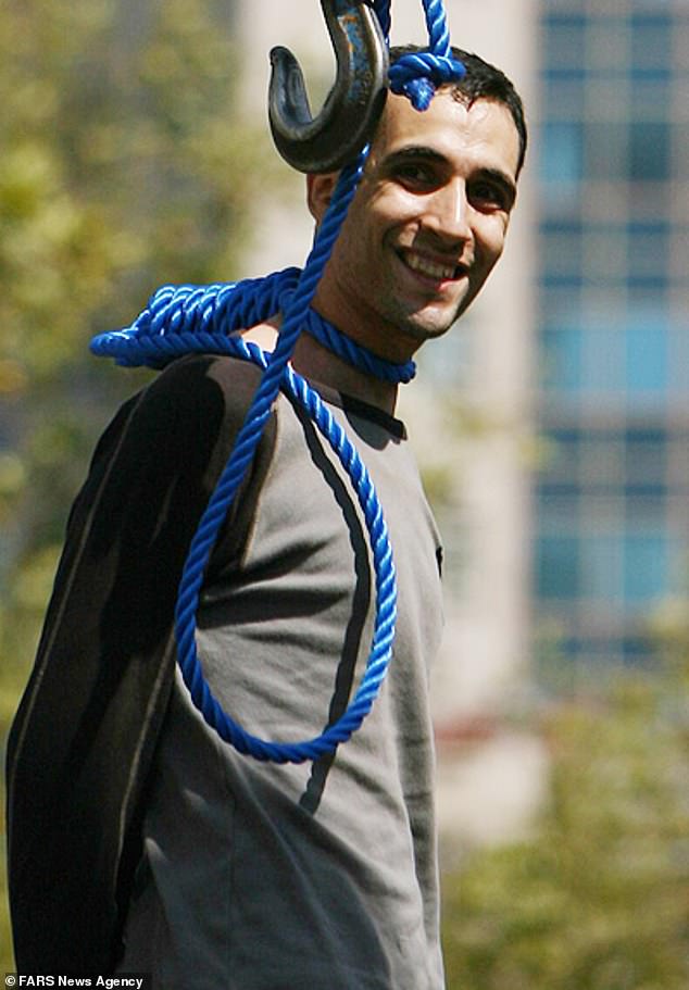 The photograph of smiling Majid Kavousifar, 28, captures the man's final moments before execution after he and his nephew Hossein, were convicted of the murder of Judge Masoud Ahmadi Moghaddasi