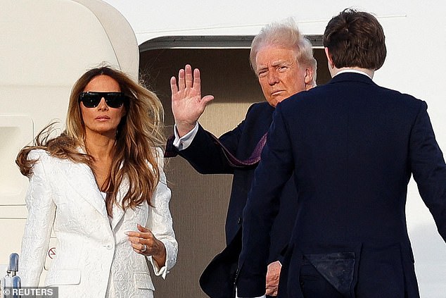 President-elect Donald Trump, his wife Melania and son Baron board a U.S. Air Force plane to travel to Dulles International Airport from Palm Beach International Airport in West Palm Beach