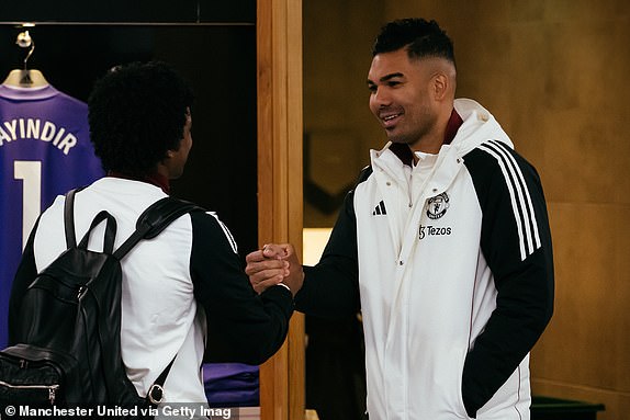 MANCHESTER, ENGLAND - JANUARY 19: Tyrell Malacia and Casemiro of Manchester United interact inside the Manchester United dressing room prior to the Premier League match between Manchester United FC and Brighton & Hove Albion FC at Old Trafford on January 19, 2025 in Manchester, England. (Photo by Ash Donelon/Manchester United via Getty Images)