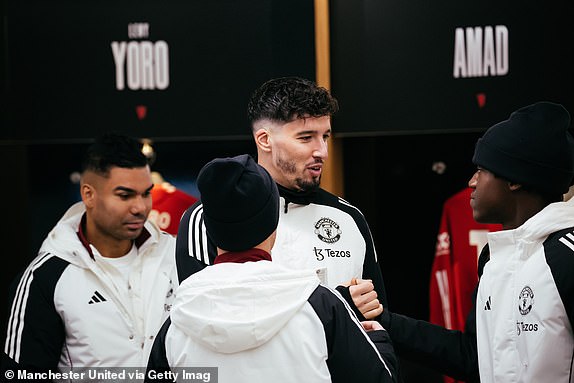 MANCHESTER, ENGLAND - JANUARY 19: Altay Bayindir of Manchester United interacts with team mates inside the Manchester United dressing room prior to the Premier League match between Manchester United FC and Brighton & Hove Albion FC at Old Trafford on January 19, 2025 in Manchester, England. (Photo by Ash Donelon/Manchester United via Getty Images)