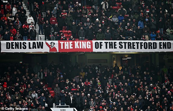 MANCHESTER, ENGLAND - JANUARY 19: A banner which reads 'Denis Law, The King of the Stretford End' is seen inside the stadium prior to the Premier League match between Manchester United FC and Brighton & Hove Albion FC at Old Trafford on January 19, 2025 in Manchester, England. (Photo by Gareth Copley/Getty Images)