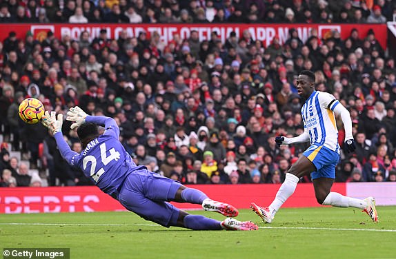 MANCHESTER, ENGLAND - JANUARY 19: Yankuba Minteh of Brighton & Hove Albion scores his team's first goal past Andre Onana of Manchester United during the Premier League match between Manchester United FC and Brighton & Hove Albion FC at Old Trafford on January 19, 2025 in Manchester, England. (Photo by Stu Forster/Getty Images)