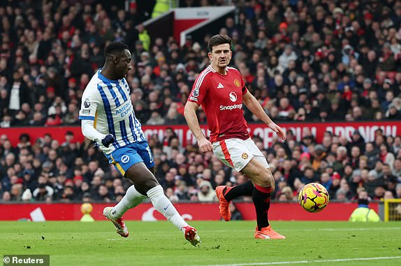 Soccer Football - Premier League - Manchester United v Brighton & Hove Albion - Old Trafford, Manchester, Britain - January 19, 2025 Brighton & Hove Albion's Yankuba Minteh scores their first goal REUTERS/Phil Noble EDITORIAL USE ONLY. NO USE WITH UNAUTHORIZED AUDIO, VIDEO, DATA, FIXTURE LISTS, CLUB/LEAGUE LOGOS OR 'LIVE' SERVICES. ONLINE IN-MATCH USE LIMITED TO 120 IMAGES, NO VIDEO EMULATION. NO USE IN BETTING, GAMES OR SINGLE CLUB/LEAGUE/PLAYER PUBLICATIONS. PLEASE CONTACT YOUR ACCOUNT REPRESENTATIVE FOR FURTHER DETAILS..