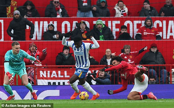 Soccer Football - Premier League - Manchester United v Brighton & Hove Albion - Old Trafford, Manchester, Britain - January 19, 2025 Brighton & Hove Albion's Carlos Baleba fouls Manchester United's Joshua Zirkzee to concede a penalty Action Images via Reuters/Phil Noble EDITORIAL USE ONLY. NO USE WITH UNAUTHORIZED AUDIO, VIDEO, DATA, FIXTURE LISTS, CLUB/LEAGUE LOGOS OR 'LIVE' SERVICES. ONLINE IN-MATCH USE LIMITED TO 120 IMAGES, NO VIDEO EMULATION. NO USE IN BETTING, GAMES OR SINGLE CLUB/LEAGUE/PLAYER PUBLICATIONS. PLEASE CONTACT YOUR ACCOUNT REPRESENTATIVE FOR FURTHER DETAILS..