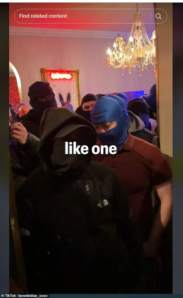 A queue of men, many wearing balaclavas, wait at Bonnie Blue's sex marathon