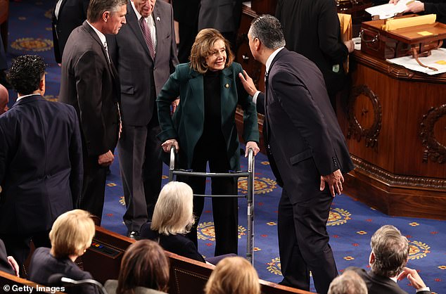 U.S. Rep. Nancy Pelosi (D-CA) uses a walker as she arrives for a joint session of Congress t