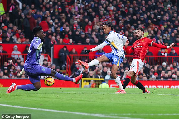 MANCHESTER, ENGLAND - JANUARY 19: Joao Pedro of Brighton and Hove Albion scores a goal that is later disallowed by VAR for a foul during the Premier League match between Manchester United FC and Brighton & Hove Albion FC at Old Trafford on January 19, 2025 in Manchester, England. (Photo by James Gill - Danehouse/Getty Images)