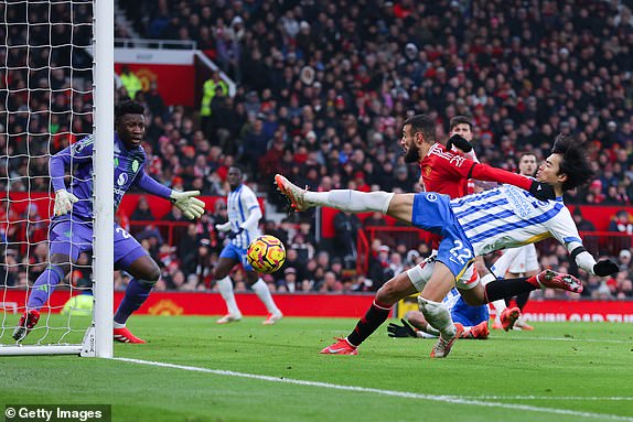 MANCHESTER, ENGLAND - JANUARY 19: Kaoru Mitoma of Brighton and Hove Albion scores their side's second goal during the Premier League match between Manchester United FC and Brighton & Hove Albion FC at Old Trafford on January 19, 2025 in Manchester, England. (Photo by James Gill - Danehouse/Getty Images)