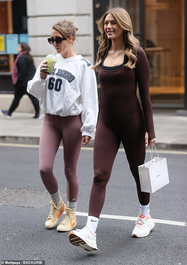 Arabella Chi (R) showcased her blossoming bump as attended the launch of her new beauty serum alongside fellow Love Island star Georgia Harrison (L) in London on Saturday