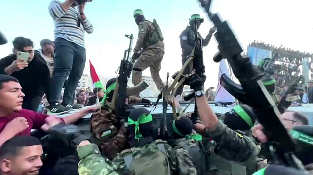 Militants could be seen standing on top of the vehicle waving their guns