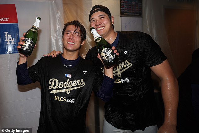 Toshinobu Yamamoto and Shohei Ohtani (right) are seen celebrating last year's World Series