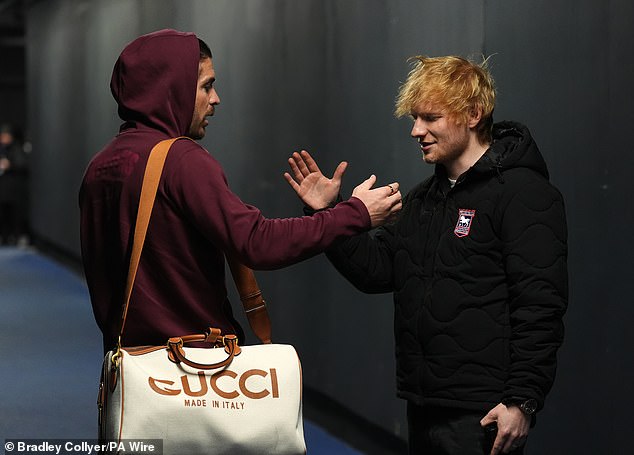 The hitmaker who is also a stakeholder in the club, greeted new dad Jack, 29 and appeared in high spirits before the Premier League game at Portman Road