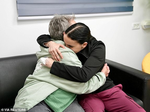 Released British-Israeli hostage Emily Damari embraces her mother, Mandy, after being held in Gaza since the deadly October 7 2023 attack by Hamas, in this?handout?image obtained by Reuters on January 19, 2025.  Courtesy of Israel Defense Forces/Handout via REUTERS  THIS IMAGE HAS BEEN SUPPLIED BY A THIRD PARTY.  BEST QUALITY AVAILABLE.