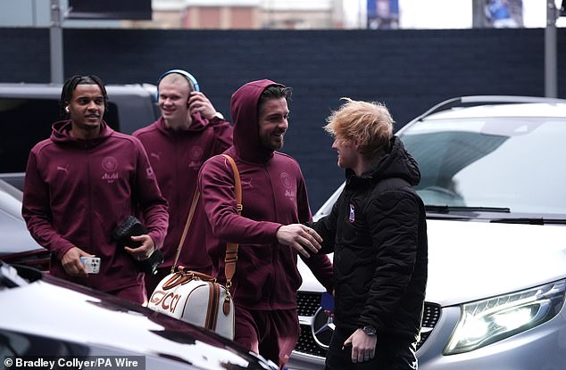 Meanwhile Jack wore a maroon tracksuit over his kit as he joined his fellow team mates