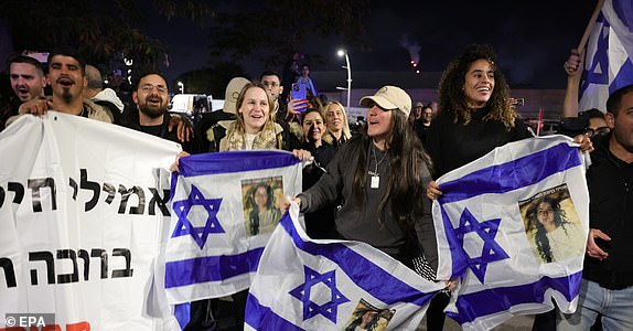 epa11837261 People gather to watch the military helicopter carrying three Israeli female hostages, Romi Gonen, Emily Damari and Doron Steinbrecher land at Sheba Medical Center in Ramat Gan, Israel, 19 January 2025. The three Israeli female hostages, Romi Gonen, Emily Damari and Doron Steinbrecher received medical treatment after crossing into Israeli territory and met with their families at Sheba Medical Center where they will continue their medical rehabilitation. Israel and Hamas agreed on a hostage release deal and a Gaza ceasefire to be implemented on 19 January 2025.  EPA/ABIR SULTAN