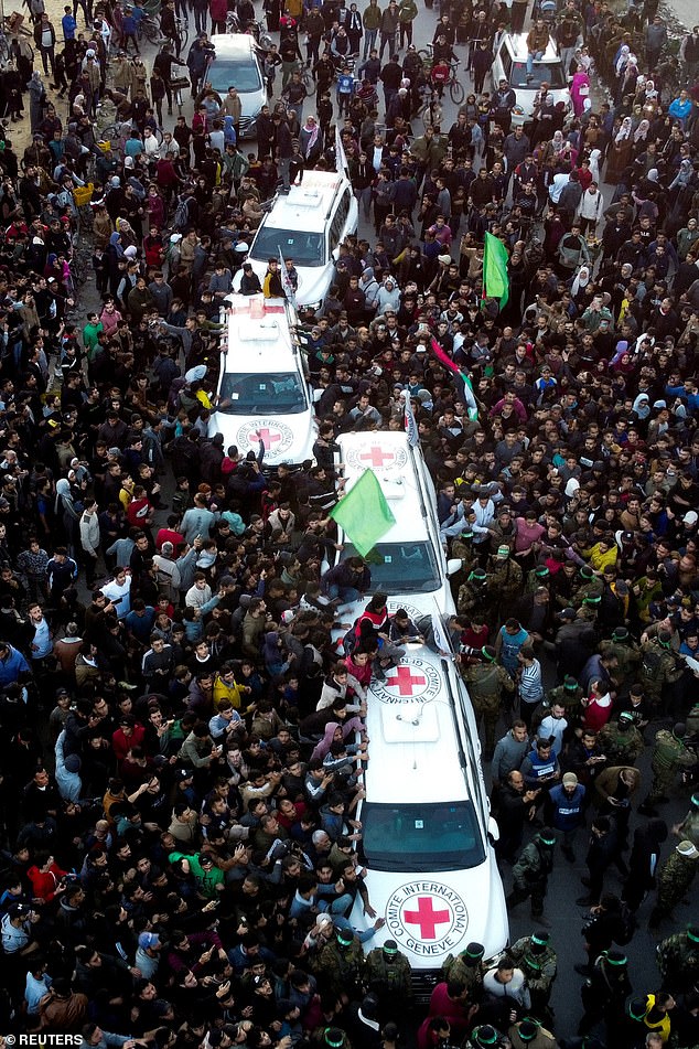 A drone view shows crowds as Palestinian Hamas militants prepared for the handover