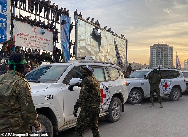 Palestinians crowded the cars as the three hostages were being released