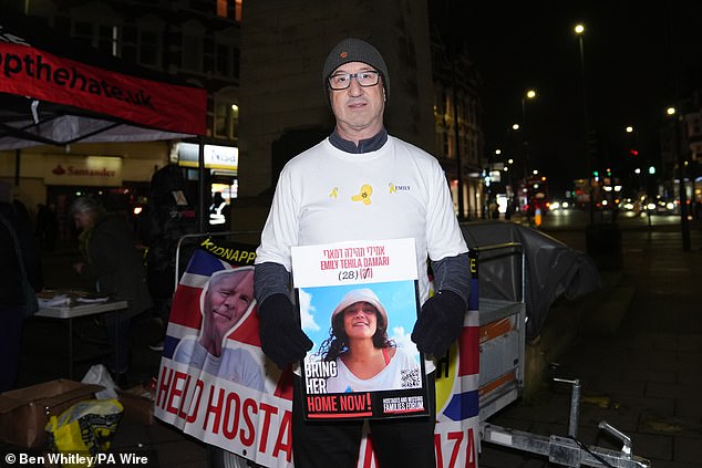 Tony Moss, Emily's cousin, joins people at a gathering at the Golders Green War Memorial, London, to celebrate her release