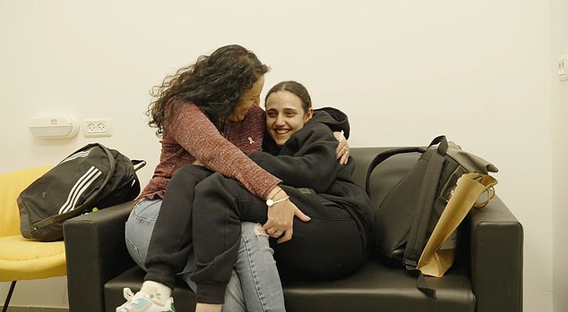 Romi Gonen and her mother smile as they are reunited