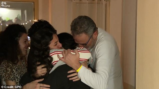 When the former hostages were brought to hospital, they were wrapped in hugs