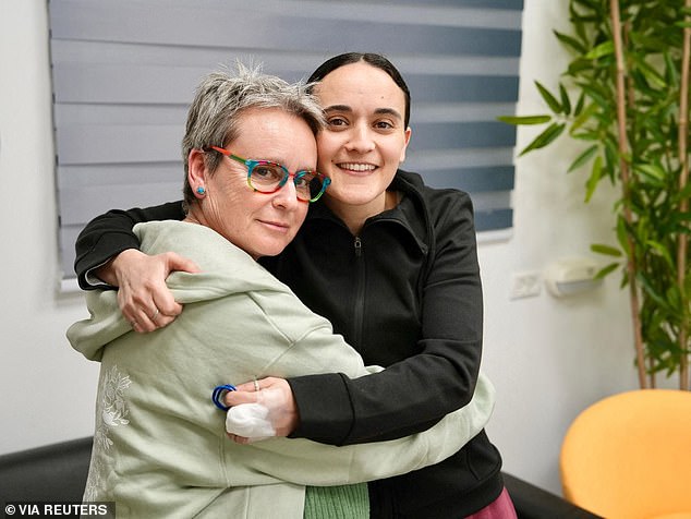 Released British-Israeli hostage Emily Damari embraces her mother, Mandy