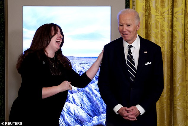 President Joe Biden smiles alongside Rhian Reyes, Campaign Organizer, Audubon, as he attends an event held to establish the monuments