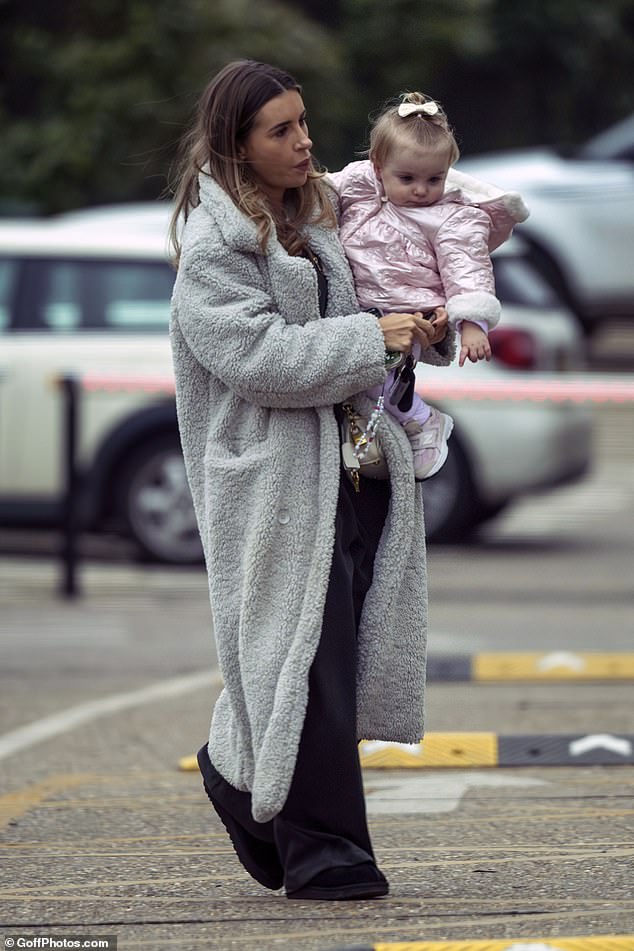 Dani Dyer pulled out the stops for her son's birthday party on Sunday as she threw a party at a soft play centre in Loughton, Essex (pictured arriving with her daughter)