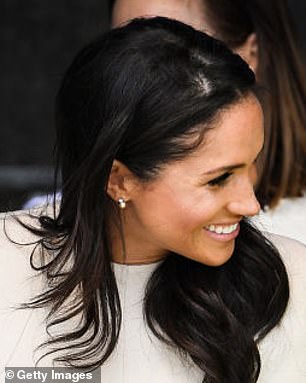 The Queen had gifted Meghan a pair of delicate pearl earrings, which she wore on her first joint engagement with the monarch in June 2018