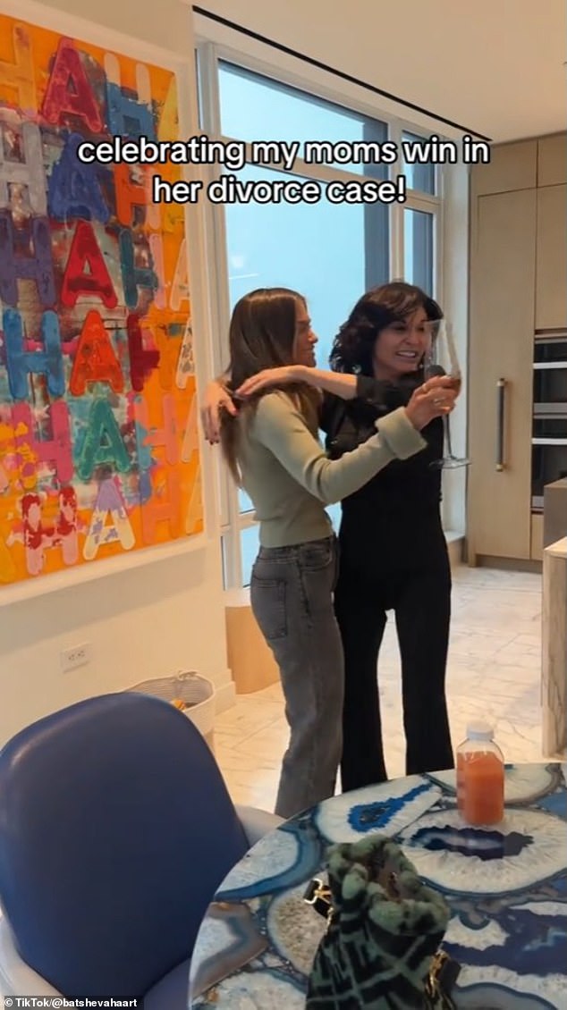 Julia could be seen in a black shirt and matching trousers as she danced around her kitchen table before sharing a hug with her daughter