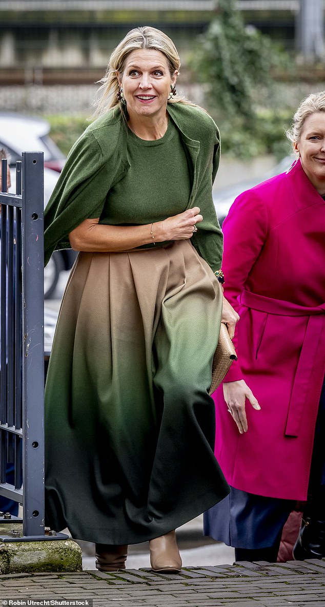 The mother-of-three looked fabulous in forest green as she touched down in the city before braving the chilly January winds