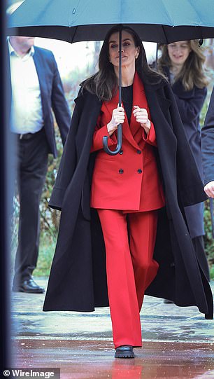 Queen Letizia looked chic while holding her umbrella today