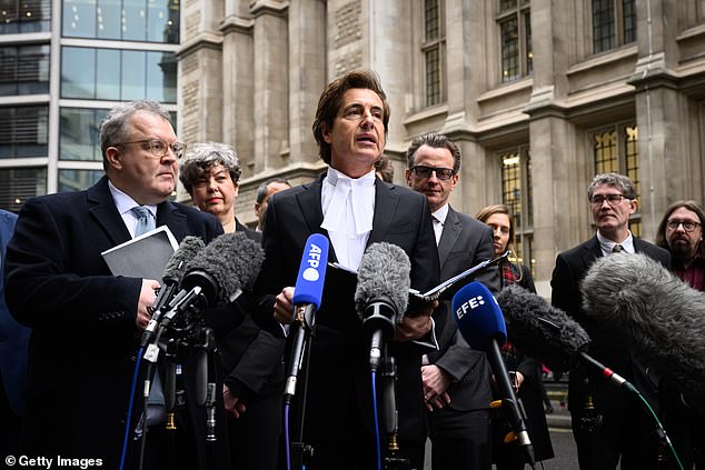 Barrister to the stars David Sherborne - standing next to client Tom Watson (left) - outside the High Court yesterday