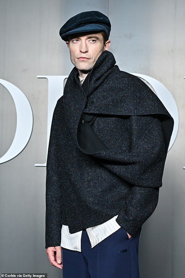 Also in attendance at the Paris Fashion Week Menswear event was Robert Pattinson, who sported a grey shawl-style cardigan