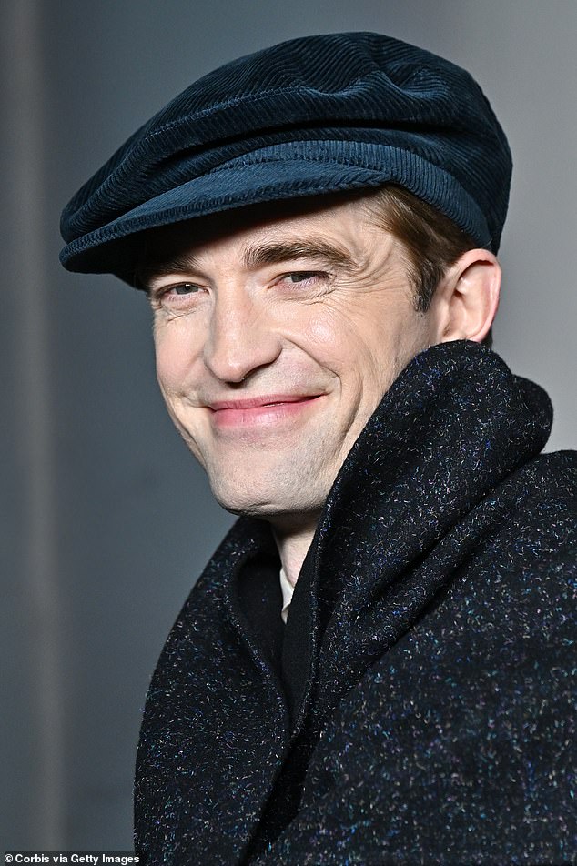 Robert Pattinson, 38, attempted an awkward smile while taking to the red carpet ahead of the Dior Menswear show at Ecole Militaire amid Paris Fashion Week on Friday