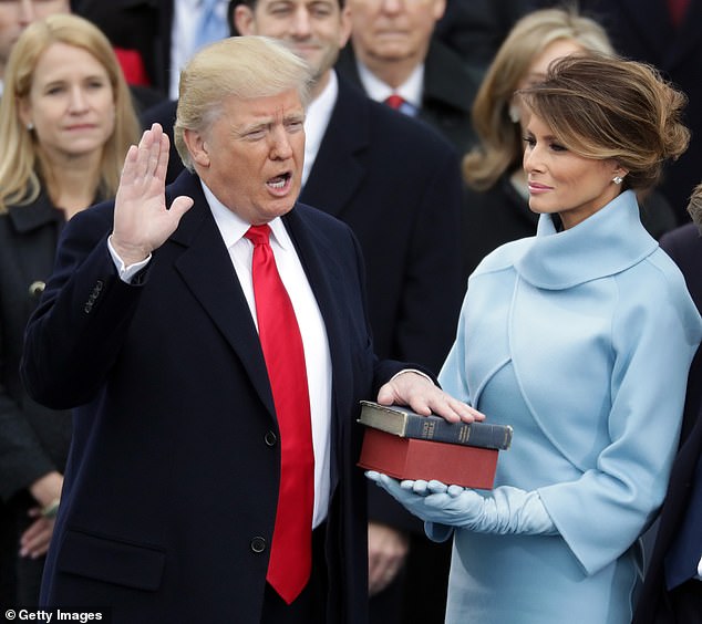 Mrs Trump wore a far more feminine and crowd-pleasing pale blue Ralph Lauren outfit for the 2017 inauguration.