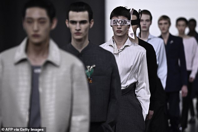 The models walked the runway in a slew of outfits at the menswear show